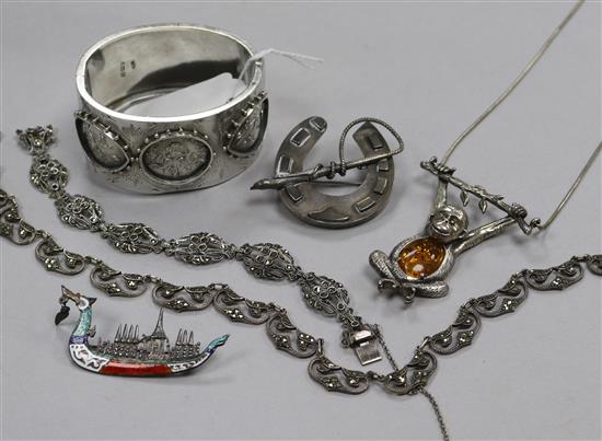 A Victorian engraved silver hinged bangle, A Siamese sterling silver & enamel brooch, amber set monkey pendant etc.